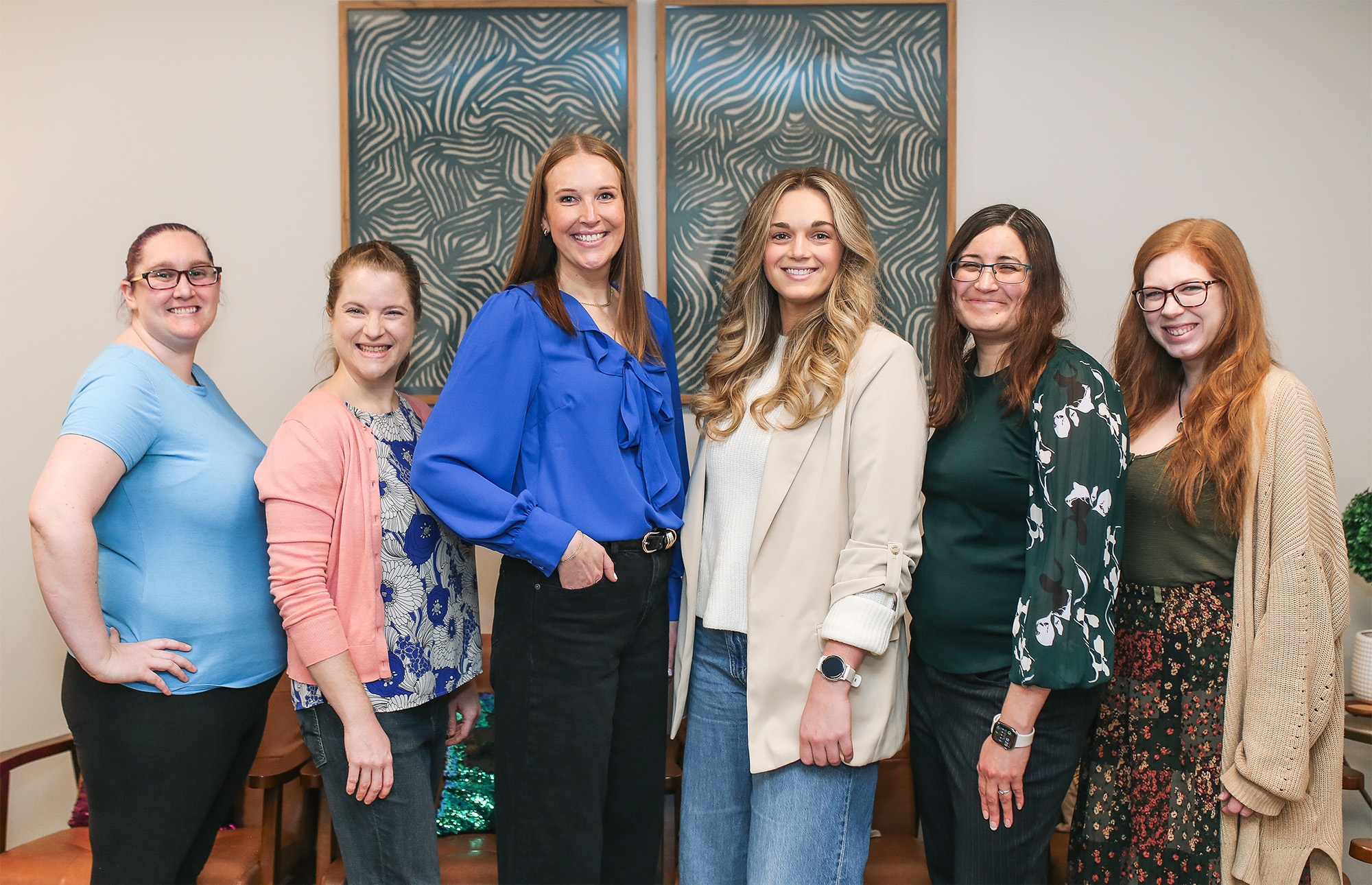 Zola Counseling Team Six female therapists on the Zola Counseling team standing in a play therapy office.